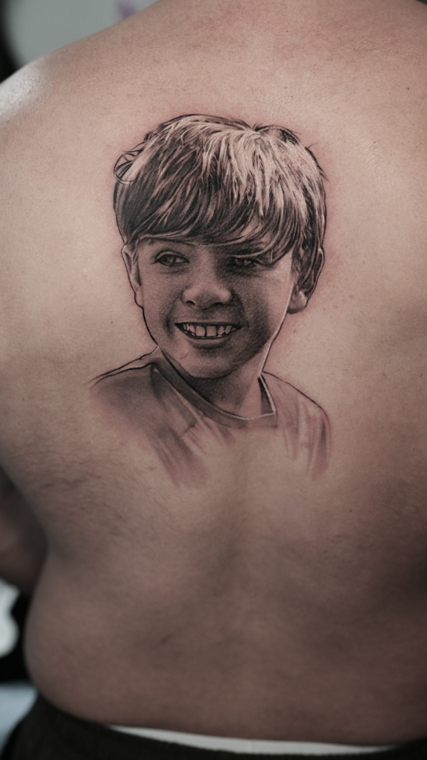Memorial portrait tattoo by Ramon Rodrigo