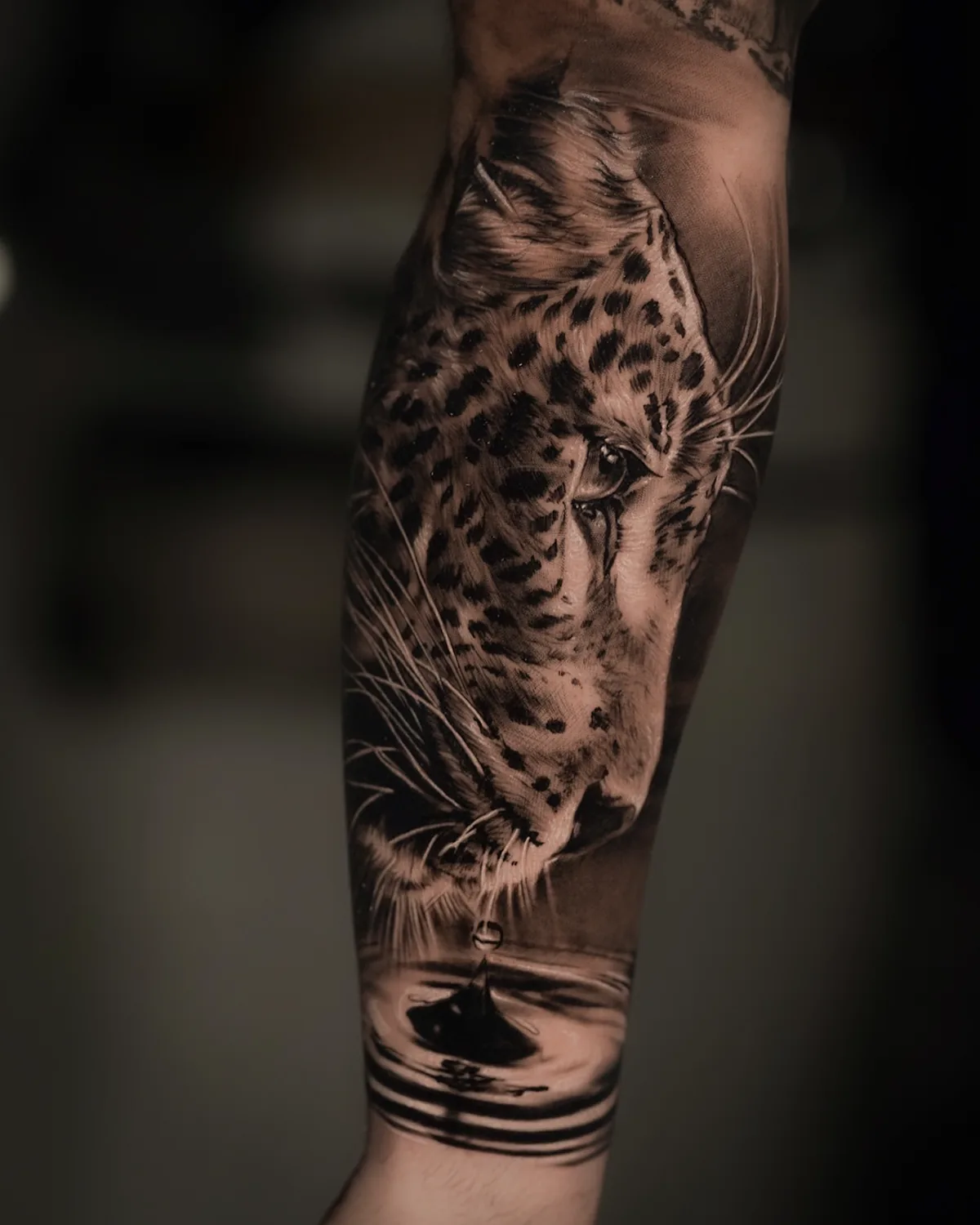 Leopard drinking water forearm tattoo by Ramon Rodrigo